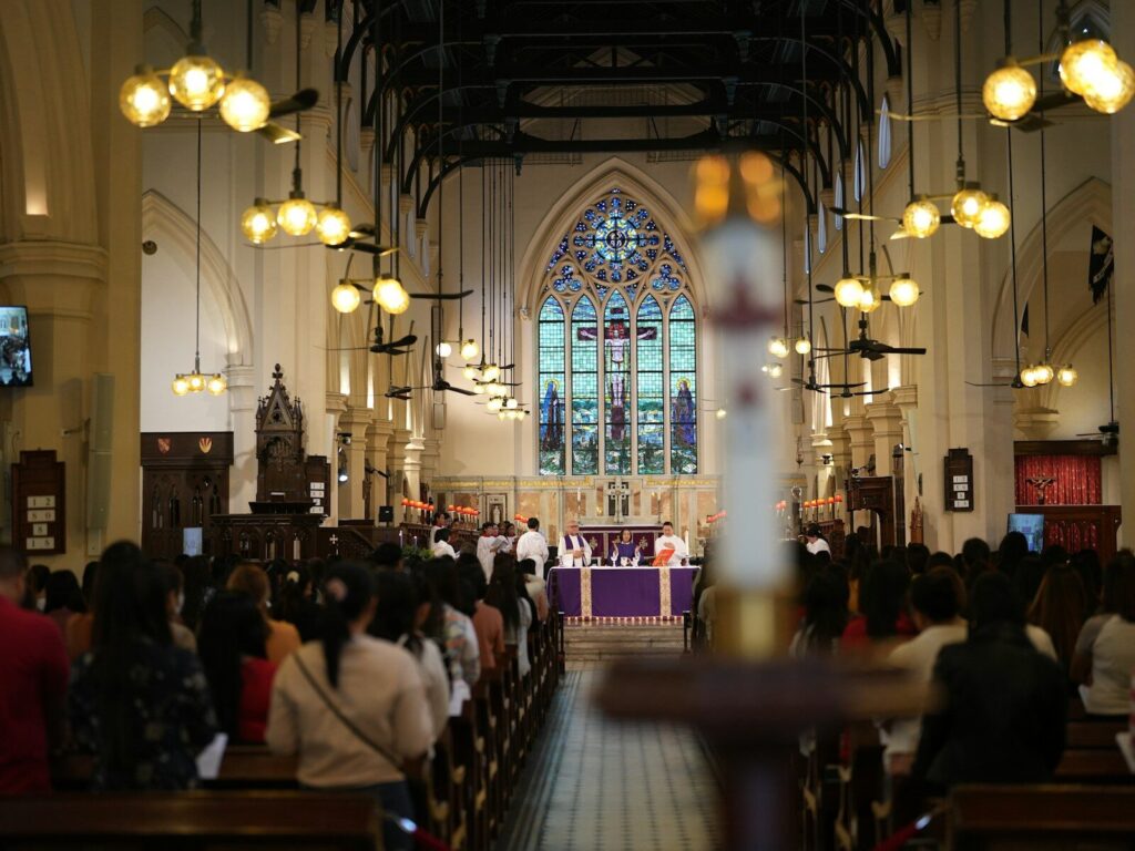a group of people sitting in a church