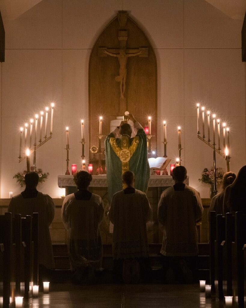 a group of people sitting in front of a church alter