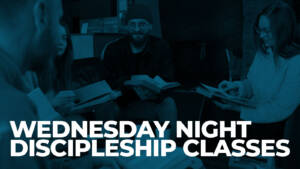 Adults study books in Wednesday night discipleship class